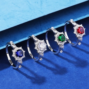 Set of four S925 silver rings with colorful center stones in floral halo settings