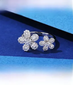Detailed macro view of S925 sterling silver daisy ring with micro-pave cubic zirconia