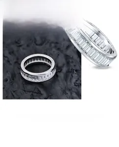 Detail view of double-row S925 silver ring featuring baguette-cut cubic zirconia insets