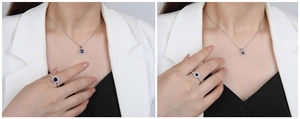 Close-up of S925 silver jewelry set with square blue sapphire pendant and ring for women