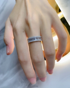 Detailed view of S925 silver ring featuring baguette cut stones and round cubic zirconia