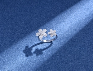 Macro detail of S925 silver daisy ring with micro-pave crystals and adjustable band