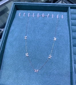 Detail of S925 sterling silver butterfly necklace with sparkling zircon butterfly charms