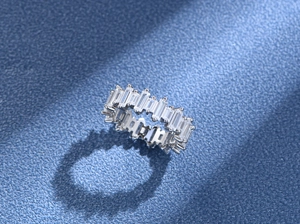 Macro shot of S925 sterling silver eternity ring featuring baguette-cut zircon stones