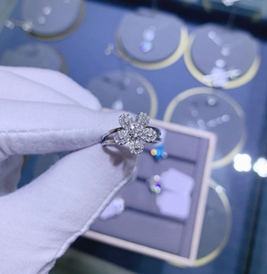 Macro detail of 925 sterling silver ring with micro-pave floral design and split band