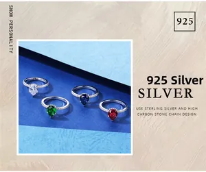 Detailed view of pear cut 925 silver rings with blue, green, and red high carbon stones