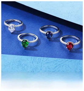 Detailed macro view of S925 silver rings with pear-cut sapphires in four vibrant colors