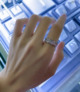 Close-up of S925 sterling silver ring with rectangular zircon inlay on a finger