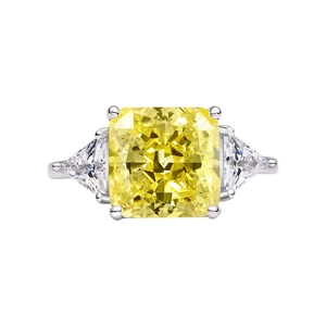 Radiant cut yellow carbon diamond ring in 925 sterling silver with triangular side stones