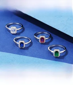 Detail of emerald cut colorful zircon rings with silver micro-pave setting