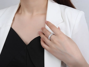 Detail view of S925 sterling silver baguette cut diamond ring worn by a model