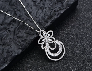 Macro shot of S925 sterling silver floral pendant with pavé-set marquise cubic zirconia