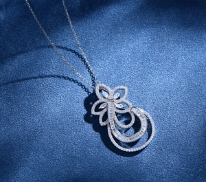 Macro detail of S925 silver floral necklace with sparkling micro-pave cubic zirconia stones
