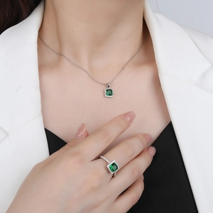 Elegant silver jewelry set with emerald green stones and halo zircon for women
