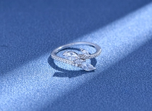 Macro view of S925 silver ring featuring marquise-cut zircons and branch leaf design