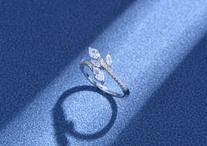 Macro detail of leaf-shaped silver ring set with marquise-cut cubic zirconia stones