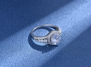 Detailed close-up of S925 hallmark on the silver band of a round zircon ring