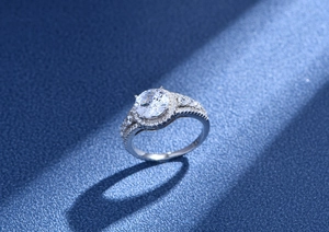 Macro detail of round 5A zircon silver ring with halo setting and pave split shank