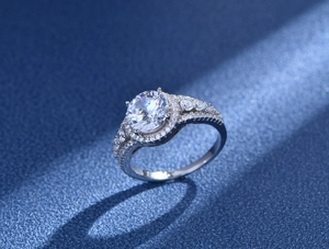 Macro shot of 925 silver ring with 8mm round zircon halo and sparkling pavé diamond setting
