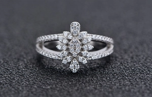 Macro shot of micro-paved S925 sterling silver flower ring with sparkling zircon stones