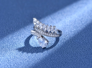 Detailed macro shot of 925 silver feather ring with marquise and teardrop zircons