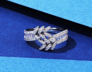 Detail of 925 silver leaf ring featuring marquise-cut zircon clusters and pavé setting