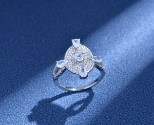 Macro shot of S925 silver ring featuring pave-set zircons and cross drop stones
