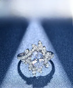 Macro shot of 925 silver ring featuring an oval-cut center stone and floral micro-pave halo