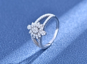 Macro detail of S925 sterling silver ring with floral micro-pave cubic zirconia stones