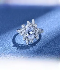 Macro detail of oval cut diamond ring with 925 silver micro-pave leaf setting