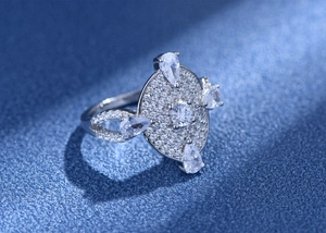 Macro shot of S925 silver ring featuring pave diamonds and teardrop-shaped zircon stones
