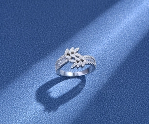 Macro shot of 925 silver leaf ring featuring double row micro-pave cubic zirconia settings