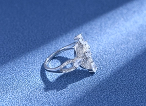 Macro shot of silver floral ring with marquise and pear shaped cubic zirconia stones