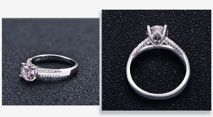Detailed macro view of 925 sterling silver ring with 4-prong set pink gemstone and side diamonds