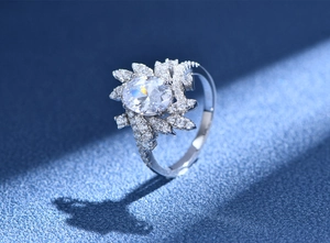 Detailed macro view of oval-cut diamond engagement ring with cluster petal setting