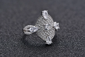 Macro view of S925 sterling silver ring with pavé diamonds and pear-cut stones