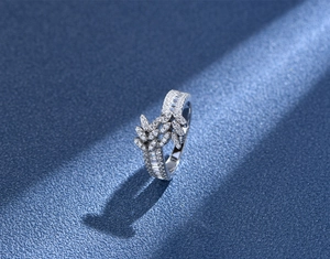 Macro shot of 925 sterling silver leaf ring with double row of pavé set crystals