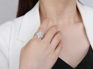 Close-up of S925 sterling silver oval ring with micro-pave crystals on a model hand
