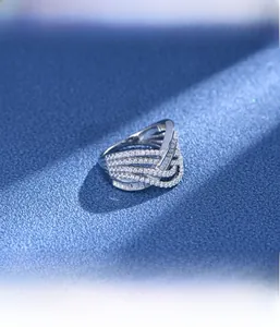 Micro-setting detail of silver multi-layer wave ring with baguette-cut diamonds