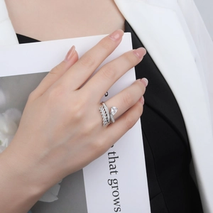 925 silver adjustable open ring with crown-shaped diamond-set design and pear-cut stone
