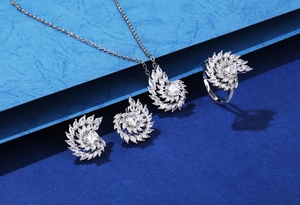 Macro detail of S925 silver swirl necklace set with sparkling marquise zirconia stones