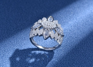 Macro shot of S925 silver floral ring featuring marquise and baguette cut zircons