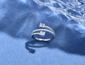 Macro shot of silver triple-layer line ring with sparkling zircon stones