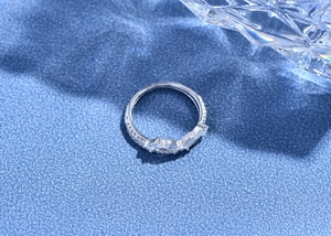 Macro shot of 925 silver crown ring featuring rectangular and round zircon gemstones