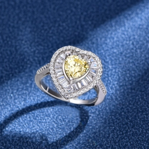 925 silver ring featuring a 7mm yellow heart-shaped diamond with halo and side stones