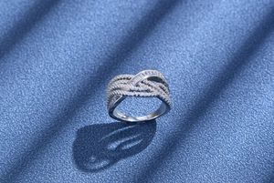 Macro shot of S925 sterling silver multilayer ring with baguette and round cut diamonds