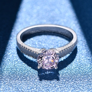 Sparkling pink stone ring in 925 silver with four-prong setting and blue starry background