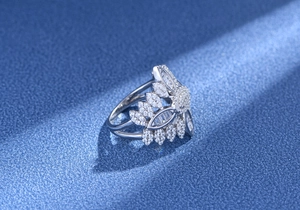 Detailed macro view of S925 silver leaf ring with intricate marquise cut pavé diamonds