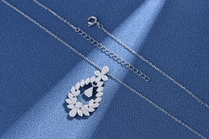 Detailed view of S925 sterling silver water-drop leaf pendant with micro-pave crystals