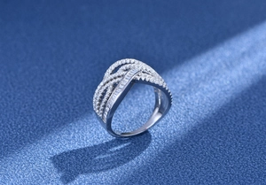 Detailed view of multilayer silver ring featuring intricate wave lines and sparkling pavé diamonds